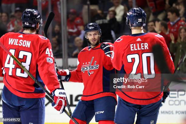 Taylor Chorney of the Washington Capitals celebrates after scoring a first period goal against the New York Islanders at Capital One Arena on...