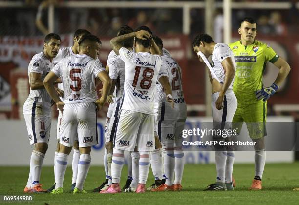 Paraguay's Nacional footballers react before leaving the pitch at half time during the Copa Sudamericana quarterfinals second leg football match...