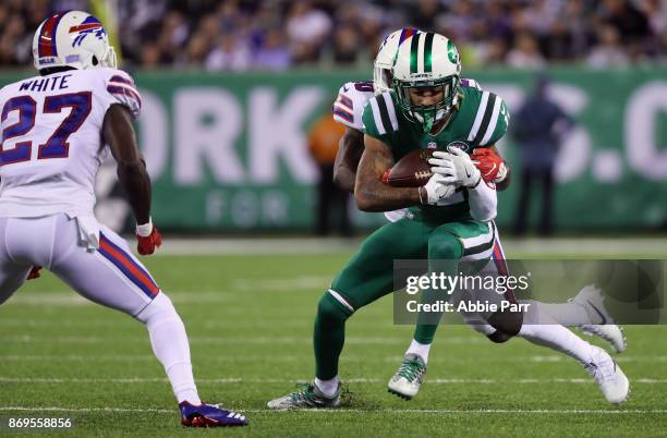 Cornerback Shareece Wright of the Buffalo Bills tackles wide receiver Robby Anderson of the New York Jets during the first quarter of the game at...