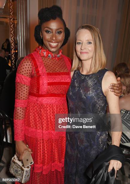 Chimamanda Ngozi Adichie, winner of the Writer of the Year award, and Jodie Foster attend Harper's Bazaar Women of the Year Awards in association...