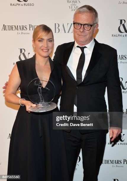 Kate Winslet, winner of the British Actress of the Year award, and Stephen Daldry attend Harper's Bazaar Women of the Year Awards in association with...