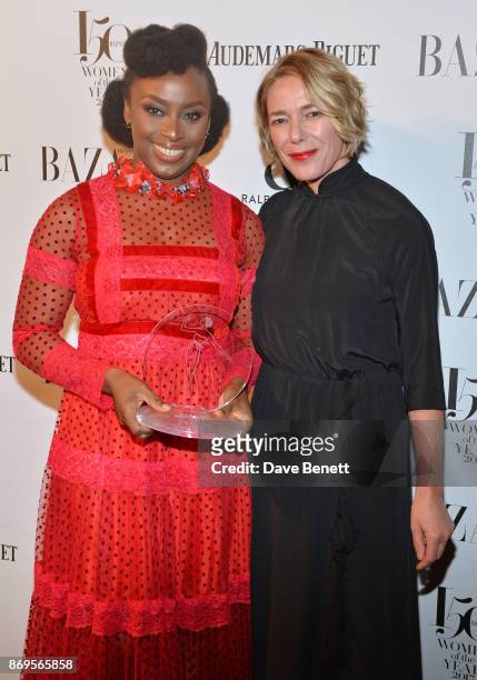 Chimamanda Ngozi Adichie, winner of the Writer of the Year award, and Sarah Chalfant attend Harper's Bazaar Women of the Year Awards in association...