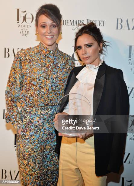 Suranne Jones and Victoria Beckham, winner of the British Brand of the Year award, attend Harper's Bazaar Women of the Year Awards in association...