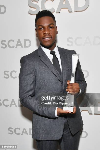Actor John Boyega poses backstage with Vanguard Award at Trustees Theater during 20th Anniversary SCAD Savannah Film Festival on November 2, 2017 in...