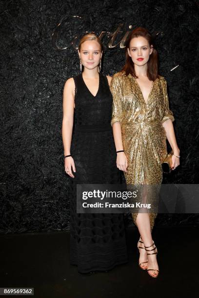 Sonja Gerhardt and Emilia Schuele wearing a Juste un Clou Bracelet and Juste un Clou Ring and the Michael Kors Collection attend the When the...