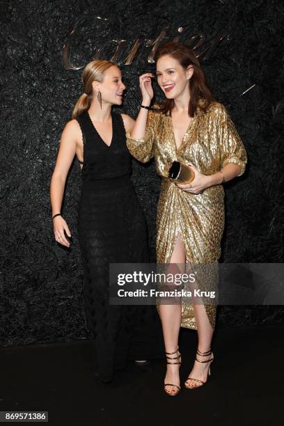 Sonja Gerhardt and Emilia Schuele wearing a Juste un Clou Bracelet and Juste un Clou Ring and the Michael Kors Collection attend the When the...