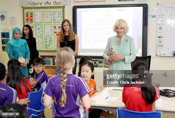 Her Majesty Raja Zarith Sofiah, The Queen of Johor and Her Royal Highness, Camilla, Duchess of Cornwall visit a classroom at The International School...