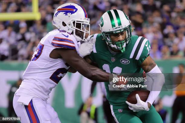 Wide receiver Robby Anderson of the New York Jets runs the ball against cornerback Tre'Davious White of the Buffalo Bills during the first half of...