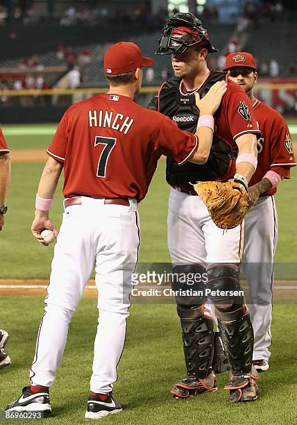 Manager A. J. Hinch of the Arizona Diamondbacks congratulates catcher Chris Snyder after the Diamondbacks defeated the Washington Nationals in the...