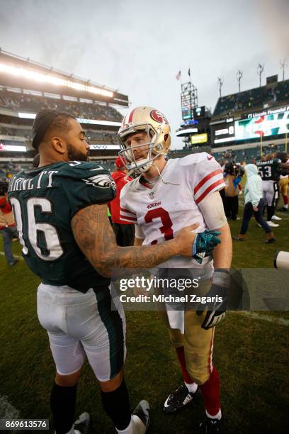 Derek Barnett of the San Francisco 49ers and C.J. Beathard of the San Francisco 49ers talk on the field following the game at Lincoln Financial Field...