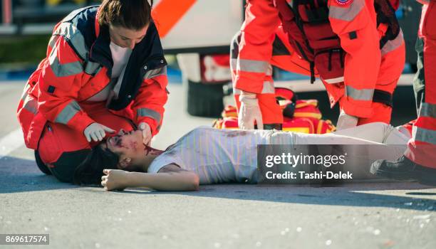 paramedic doctor examining - accident victim stock pictures, royalty-free photos & images