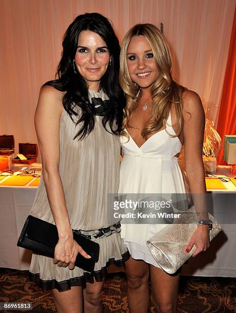Actresses Angie Harmon and Amanda Bynes attend the 16th Annual Race To Erase MS cocktail reception co-chaired by Nancy Davis and Tommy Hilfiger at...