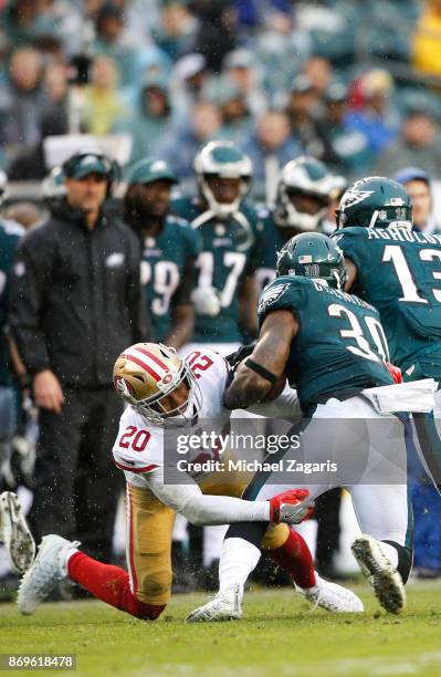 Leon Hall of the San Francisco 49ers tackles Corey Clement of the Philadelphia Eagles during the game at Lincoln Financial Field on October 29, 2017...