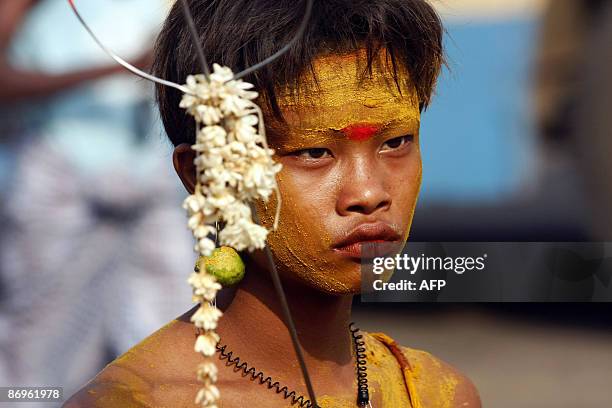 Photo taken May 8, 2009 shows a Hindu man as he prepares to walk on hot coals during a fire festival in the Yankin township of Kanbet in Yangon,...