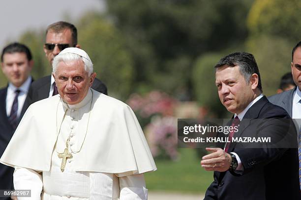 Pope Benedict XVI walks next to Jordan's King Abdullah II before boarding a plane from Amman's airport heading to Tel Aviv on May 11, 2009 following...