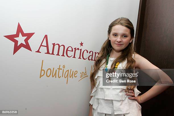 Actress Abigail Breslin poses for photos while on a promotional tour for her new Picturehouse film "Kit Kittredge: An American Girl" at the American...