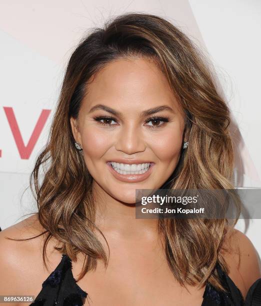 Chrissy Teigen arrives at #REVOLVEawards at DREAM Hollywood on November 2, 2017 in Hollywood, California.