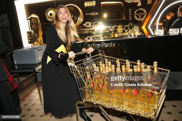 Blogger Veronika Heilbrunner with a cart of champaign during the 'When the Ordinary becomes Precious #CartierParty Berlin ' at Old Power Station on...