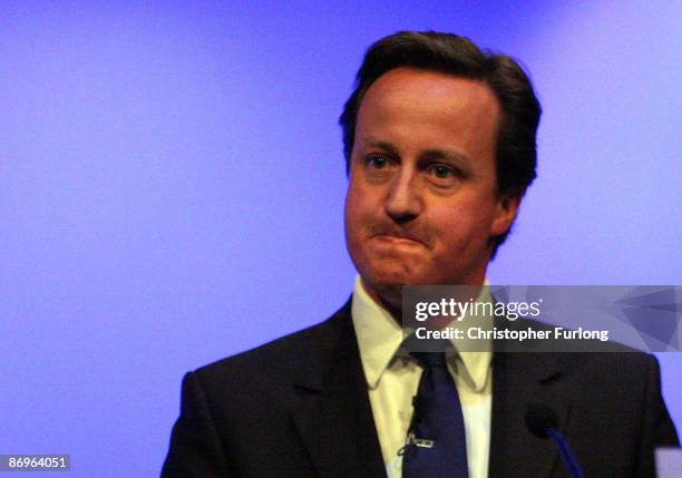 Leader of Britain's Conservative party, David Cameron, gestures during his address to the Royal College of Nurses congress in Harrogate on May 11,...