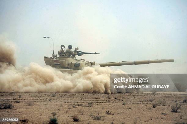 Refurbished Russian made T-55 tank roles during a training operation at a desert range some 40 kms south of the town of Latifiyah, on May 11 2009....