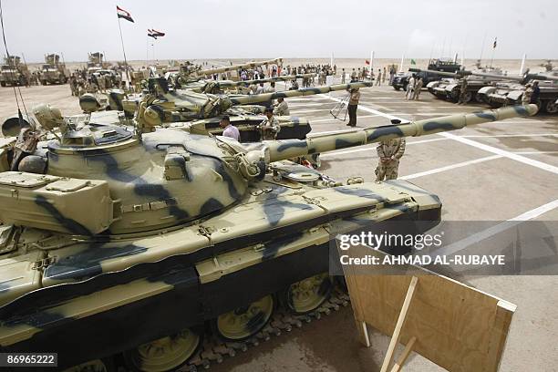 Refurbished Russian made T-72 tanks are on display during training operations at a desert range some 40 kms south of the town of Latifiyah, on May 11...
