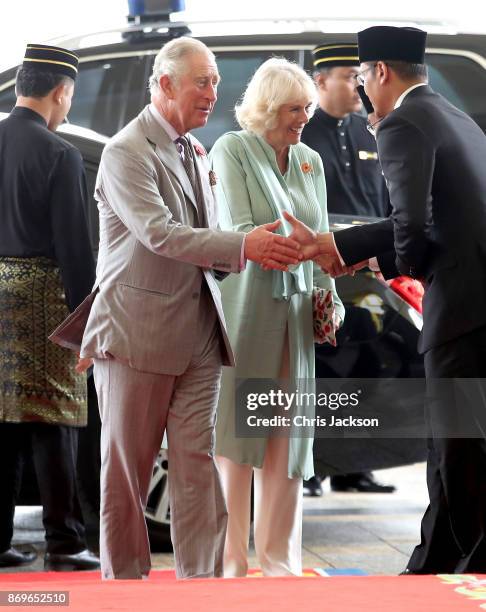 Prince Charles, Prince of Wales and Camilla, Duchess of Cornwall are greeted as they arrive for Tea with His Majesty The Yang di-Pertuan Agong XV...