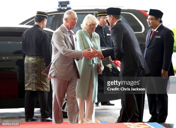 Prince Charles, Prince of Wales and Camilla, Duchess of Cornwall are greeted as they arrive for Tea with His Majesty The Yang di-Pertuan Agong XV...