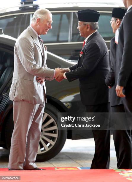 Prince Charles, Prince of Wales is greeted as he arrives with Camilla, Duchess of Cornwall for Tea with His Majesty The Yang di-Pertuan Agong XV...