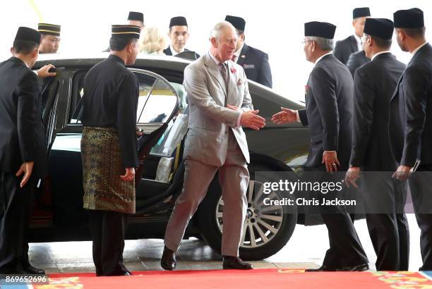 Prince Charles, Prince of Wales is greeted as he arrives with Camilla, Duchess of Cornwall for Tea with His Majesty The Yang di-Pertuan Agong XV...