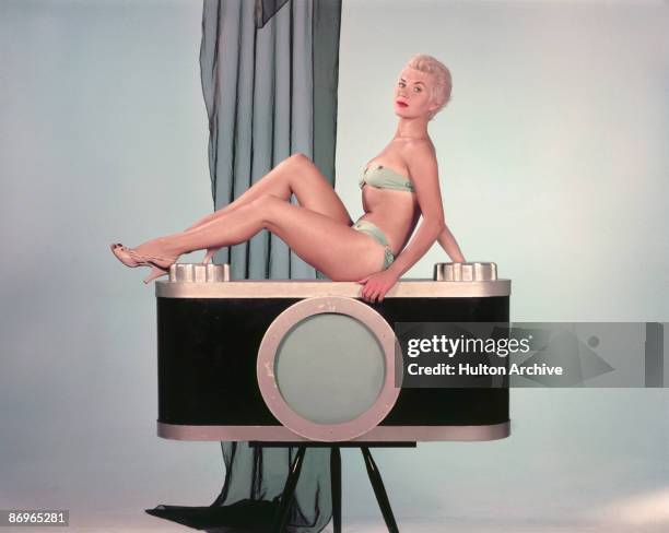 Actress Vera Day poses in a bikini at Shepperton Studios, where she is starring in the film 'It's a Great Day', 1955.