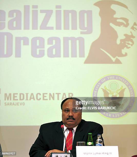 Martin Luther King III , son of Martin Luther King listens to a journalist's question during a press conference upon arrival in Sarajevo, on May 11,...