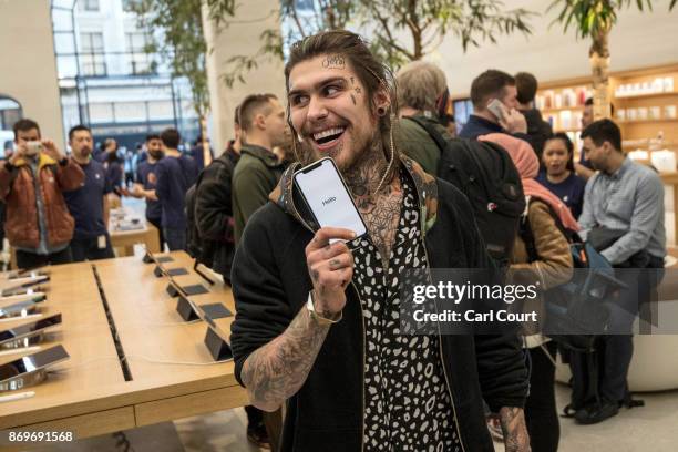Marco Pierre White Jr poses with an iPhone X after being the first to buy one upon its release in the U.K, on November 3, 2017 in London, England....