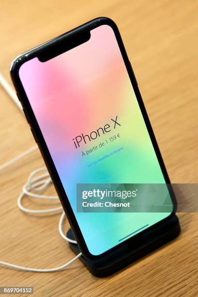 An Apple iPhone X, the new model of Apple smartphone is displayed at the Apple Store Saint-Germain on November 3, 2017 in Paris, France. Apple's...