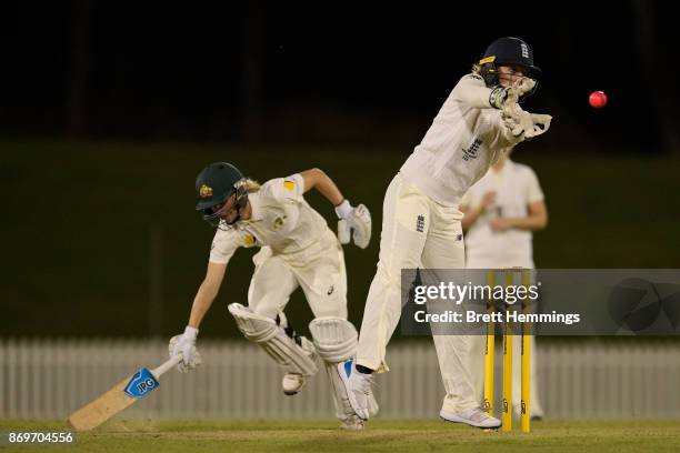 Sarah Taylor of England attempts to run out Nicola Carey of CAXI during day one of the Women's Tour match between England and the Cricket Australia...