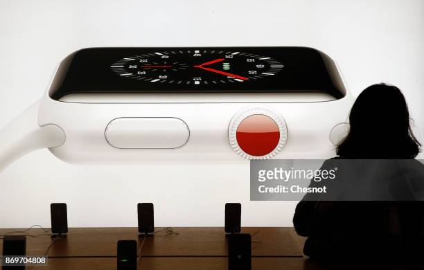 Signage for an Apple Watch Series 3 is displayed inside the Apple Store Saint-Germain, the day of the launch of the Apple iPhone X, the new model of...
