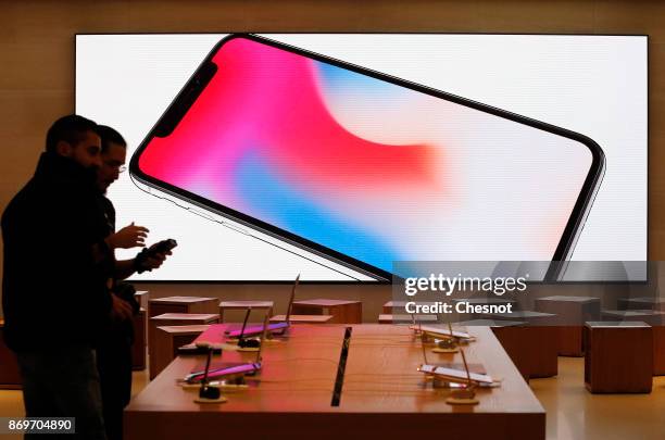 Signage for an Apple iPhone X, the new model of Apple smartphone is displayed inside the Apple Store Saint-Germain on November 3, 2017 in Paris,...