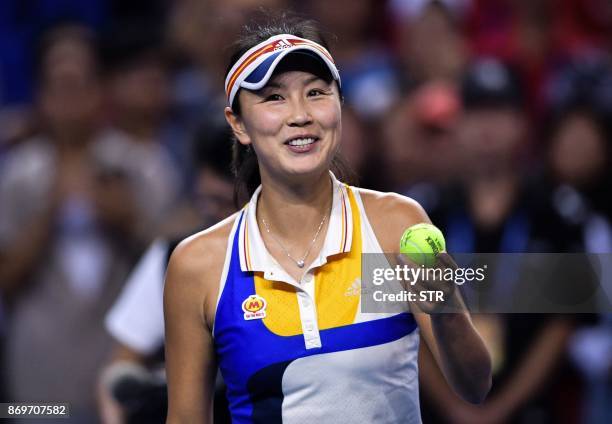 Peng Shuai of China reacts during her women's singles match against Elena Vesnina of Russia at the Zhuhai Elite Trophy tennis tournament in Zhuhai,...