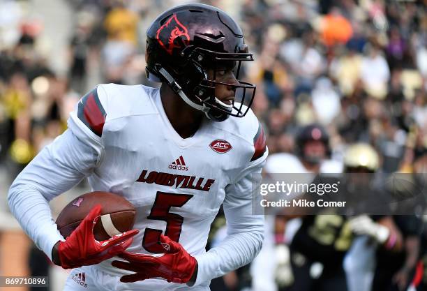 Wide receiver Seth Dawkins of the Louisville Cardinals runs with the football against the Wake Forest Demon Deacons during the football game at BB&T...