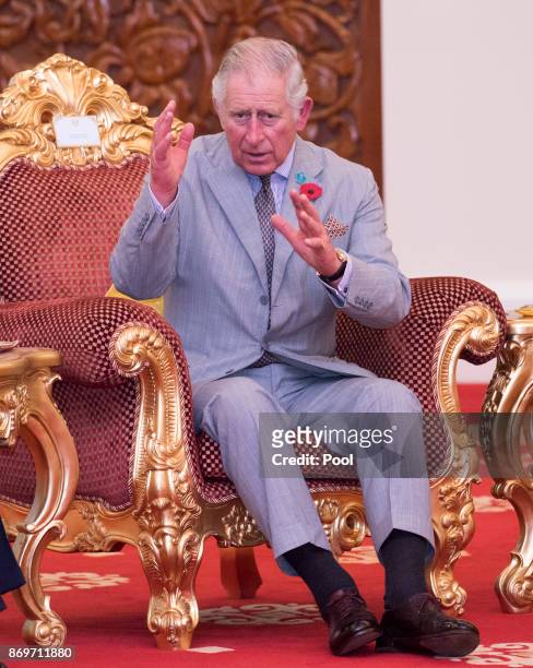 Prince Charles,The Prince of Wales talks with His Majesty The Yang di-Pertuan Agong XV Sultan Muhammad V at his official residence, Istana Negara on...