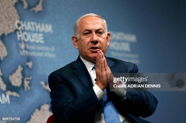 Israeli Prime Minister Benjamin Netanyahu gestures while giving a lecture regarding Israel's foreign policy priorities at Chatham House, The Royal...