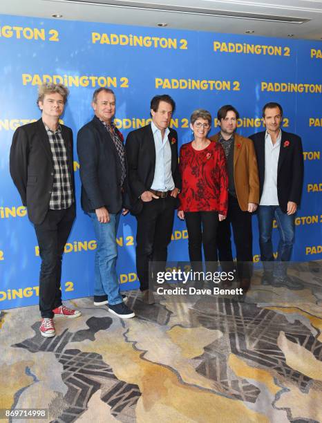 Co-writer Simon Farnaby, Hugh Bonneville, Hugh Grant, Karen Jankel, director Paul King and producer David Heyman attend a photocall for "Paddington...