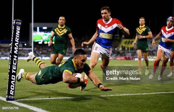 Valentine Holmes of Australia dives to score during the 2017 Rugby League World Cup match between Australian Kangaroos and France at Canberra Stadium...
