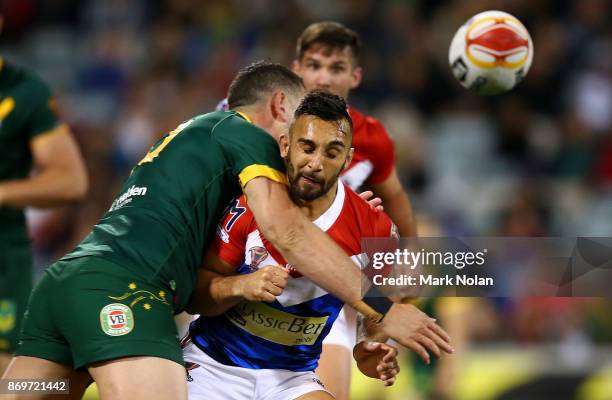 Eloi Pelissier of France is tackled late after passing the ball during the 2017 Rugby League World Cup match between Australian Kangaroos and France...