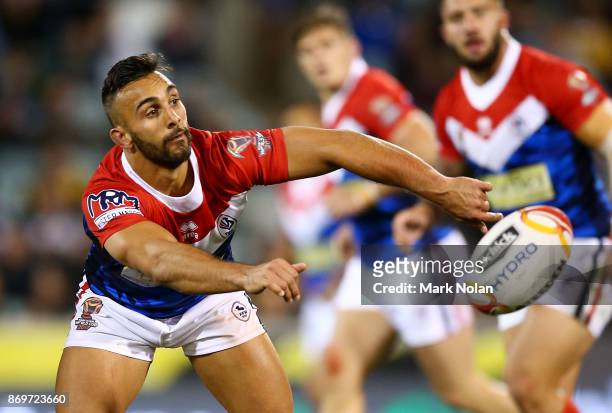 Eloi Pelissier of France passes during the 2017 Rugby League World Cup match between Australian Kangaroos and France at Canberra Stadium on November...