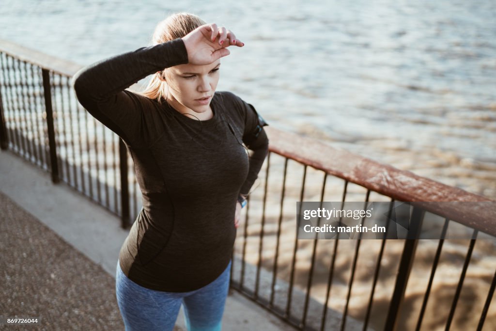 Sportswoman taking a breath