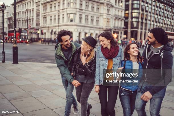 friends hanging out in uk - guy girl street laugh stock pictures, royalty-free photos & images