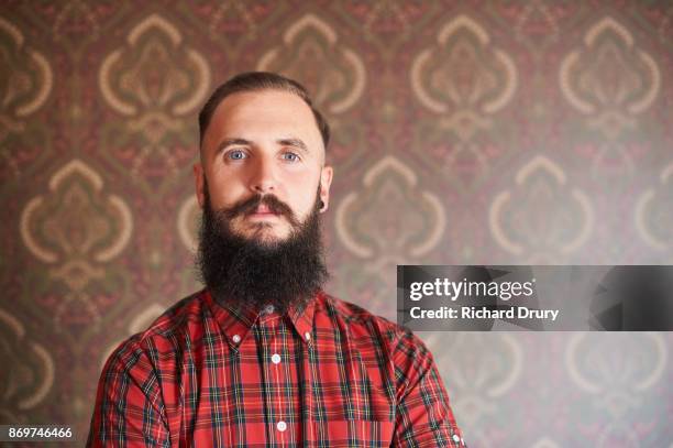 portrait of hipster in his front room - red beard stock pictures, royalty-free photos & images