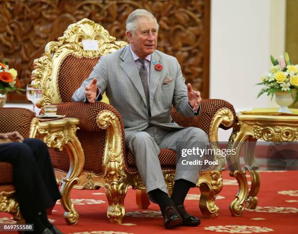 Prince Charles,The Prince of Wales talks with His Majesty The Yang di-Pertuan Agong XV Sultan Muhammad V at his official residence, Istana Negara on...