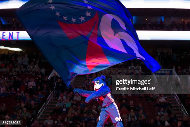 Philadelphia 76ers mascot Franklin the Dog waves the team flag prior to the game against the Atlanta Hawks at the Wells Fargo Center on November 1,...