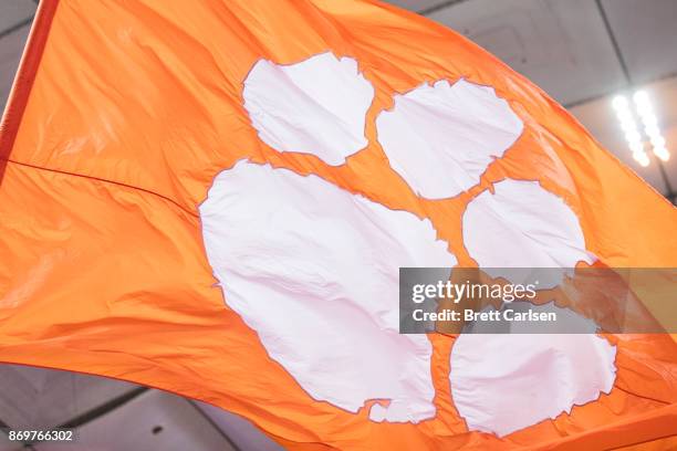 Clemson Tigers logo flag is waived by cheerleaders during the game against the Syracuse Orange at the Carrier Dome on October 13, 2017 in Syracuse,...